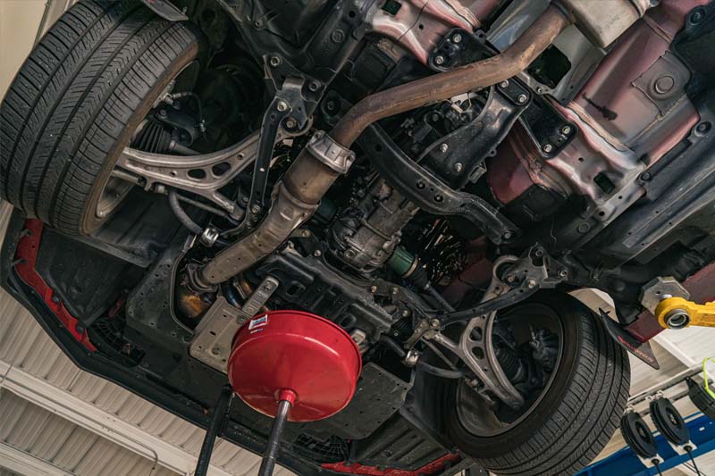 M45 Automotive technician performing clutch and drivetrain service on a Subaru in Auburn, CA